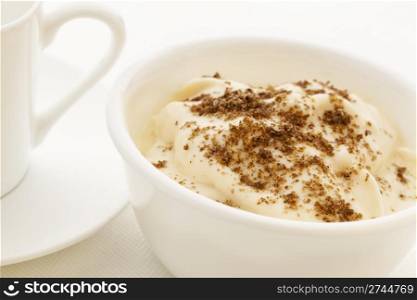 ground chia seeds sprinkled on yogurt - healthy breakfast concept