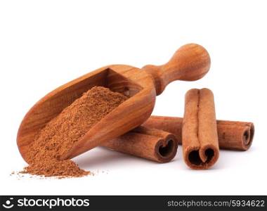 ground cinnamon spice powder in wooden spoon isolated on white background cutout