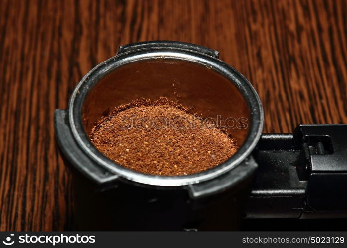 ground coffee on wooden table ready to prepare