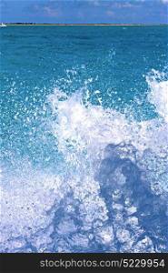 ground in mexico froath and blue foam the sea drop sunny day