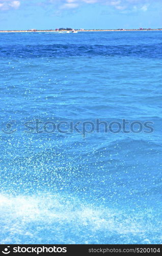 ground in mexico froath and blue foam the sea drop sunny day wave