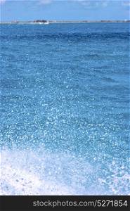 ground in mexico froath and blue foam the sea drop sunny day wave