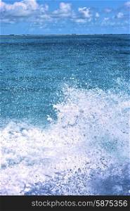 ground in mexico froath and blue foam the sea drop sunny day wave