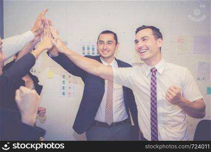Group business asian people team with success gesture giving hi five in the meeting, agreement with achievement work of teamwork together.