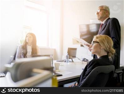 group businesspeople attending presentation office