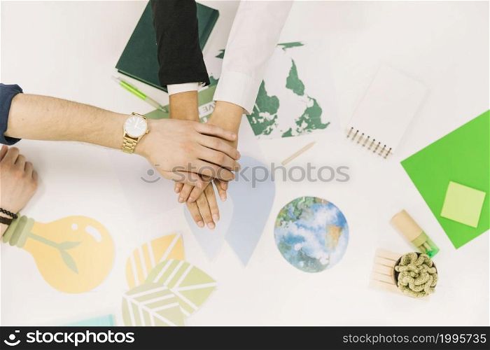group businesspeople stacking their hands desk