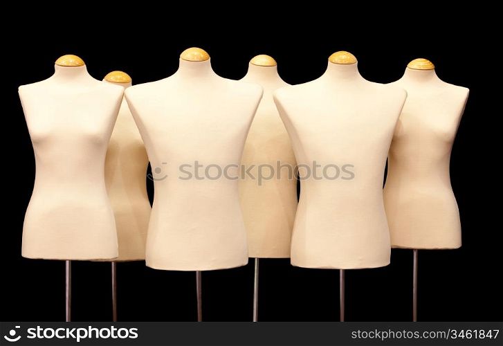 Group dummies isolated on black background