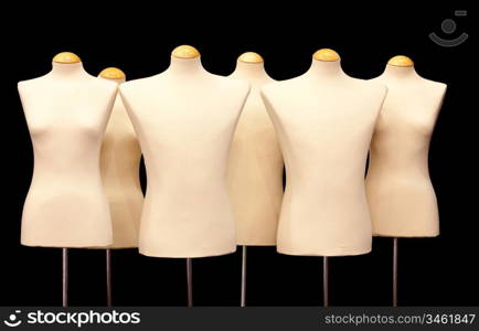 Group dummies isolated on black background