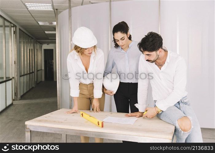 group engineers leaning table