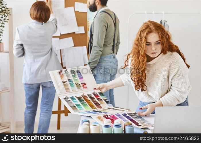 group fashion designer working atelier with idea board color palette
