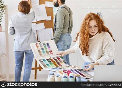 group fashion designer working atelier with idea board color palette