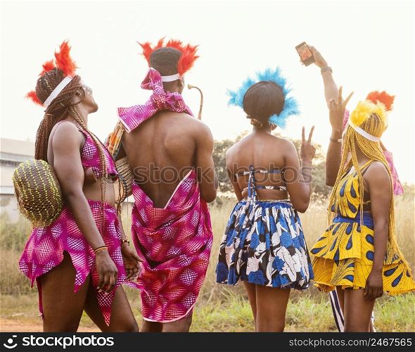 group friends african carnival wearing costumes