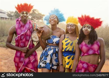 group friends african carnival with costumes
