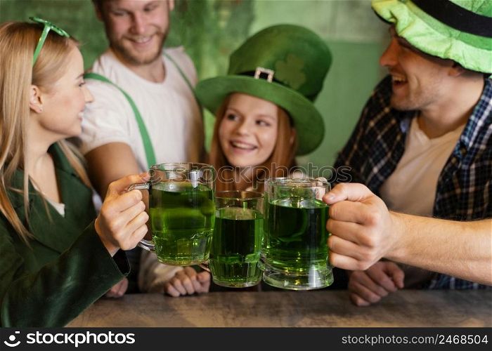 group friends celebrating st patrick s day together bar with drinks