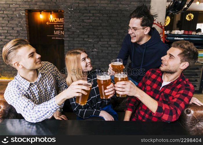 group friends enjoying beer pub