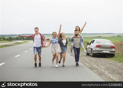 group friends enjoying road