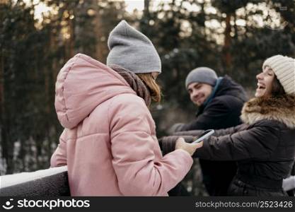 group friends having fun outdoors winter