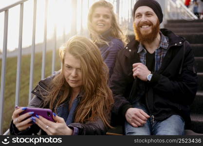 group friends with smartphone stairs