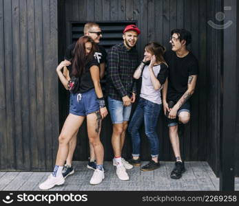 group happy friends making fun front wooden wall