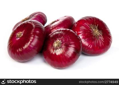 Group of a red onions, isolated against white background