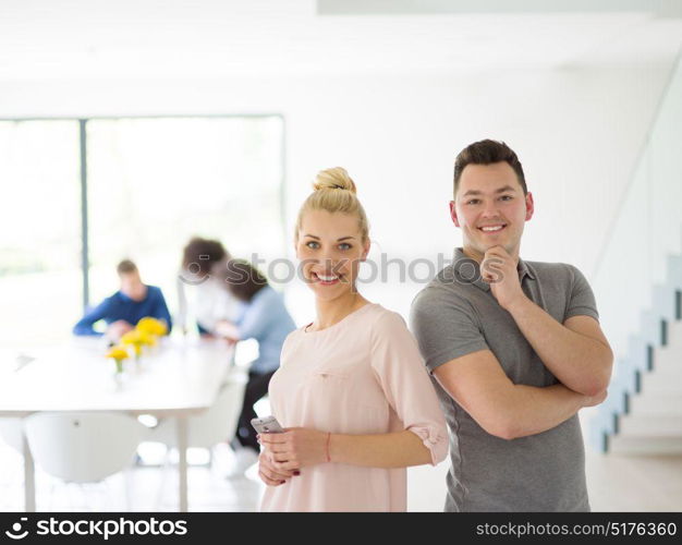 Group of a young business people discussing business plan at modern startup office building