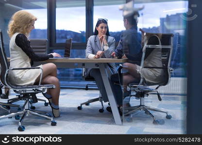 Group of a young business people discussing business plan at modern startup office building