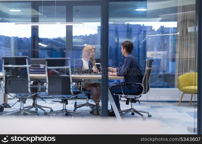 Group of a young business people discussing business plan at modern startup office building