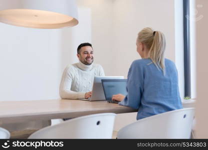 Group of a young business people discussing business plan at modern startup office building