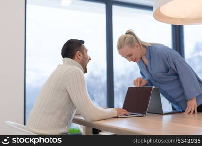 Group of a young business people discussing business plan at modern startup office building