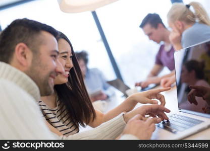 Group of a young business people discussing business plan at modern startup office building