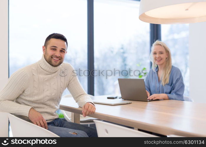 Group of a young business people discussing business plan at modern startup office building