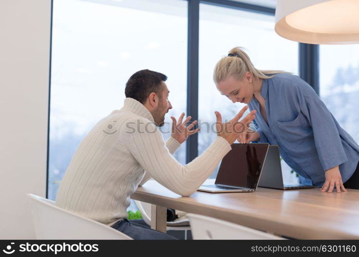 Group of a young business people discussing business plan at modern startup office building