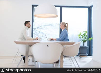 Group of a young business people discussing business plan at modern startup office building