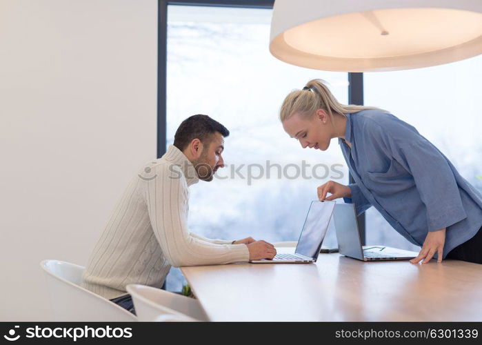 Group of a young business people discussing business plan at modern startup office building