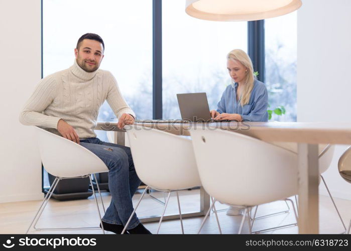 Group of a young business people discussing business plan at modern startup office building