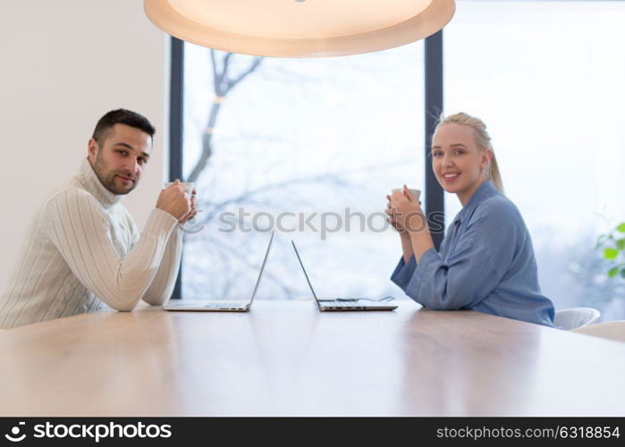 Group of a young business people discussing business plan at modern startup office building