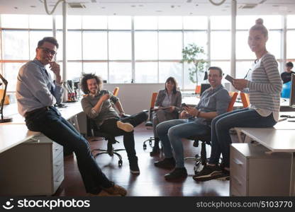 Group of a young business people discussing business plan in the office