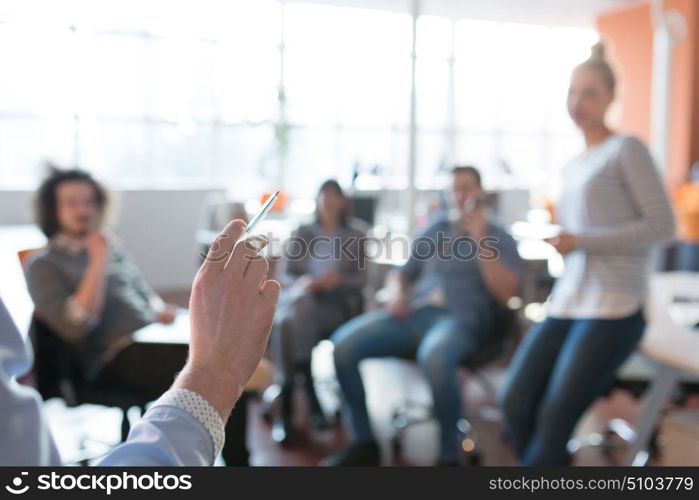 Group of a young business people discussing business plan in the office