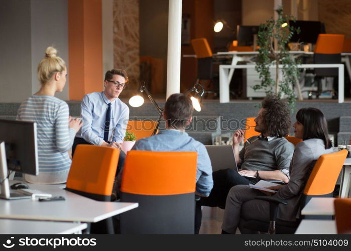 Group of a young business people discussing business plan in the office