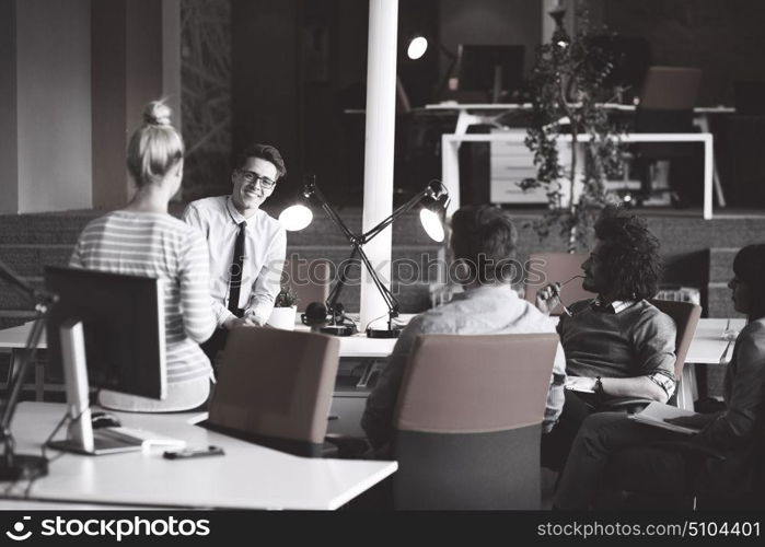 Group of a young business people discussing business plan in the office