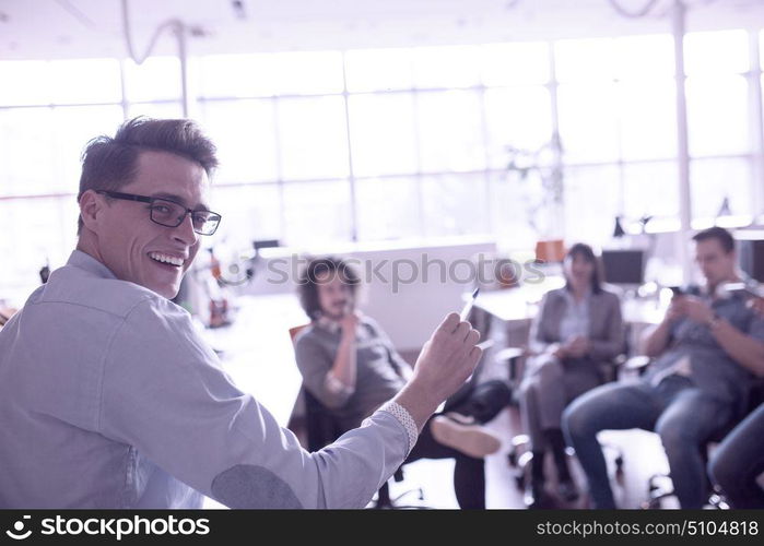 Group of a young business people discussing business plan in the office