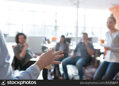 Group of a young business people discussing business plan in the office