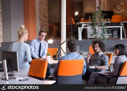 Group of a young business people discussing business plan in the office