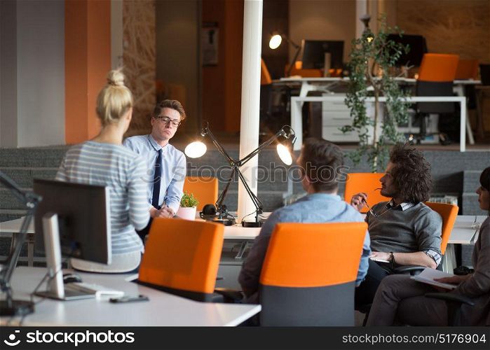 Group of a young business people discussing in the office