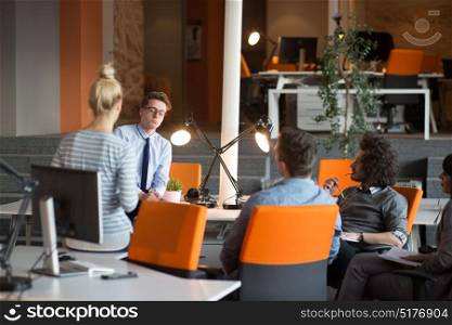 Group of a young business people discussing in the office
