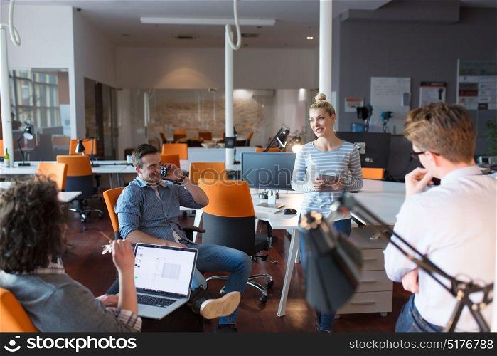 Group of a young business people having a meeting at their office