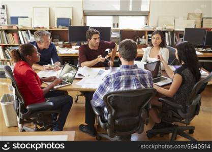 Group Of Architects Meeting Around Desk