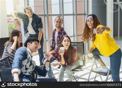 Group Of Asian and Multiethnic Business people with casual suit having selfie together between working in happy action in the modern workplace, people business group concept