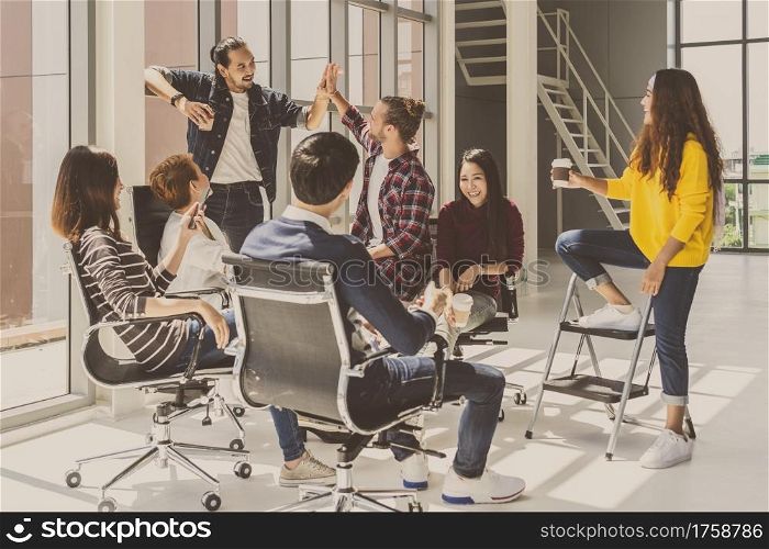 Group Of Asian and Multiethnic Business people with casual suit talking and brainstorming with happy action in creative style in the modern workplace, modern creative and design worker concept