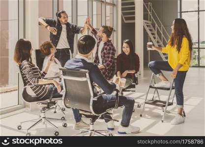 Group Of Asian and Multiethnic Business people with casual suit talking and brainstorming with happy action in creative style in the modern workplace, modern creative and design worker concept